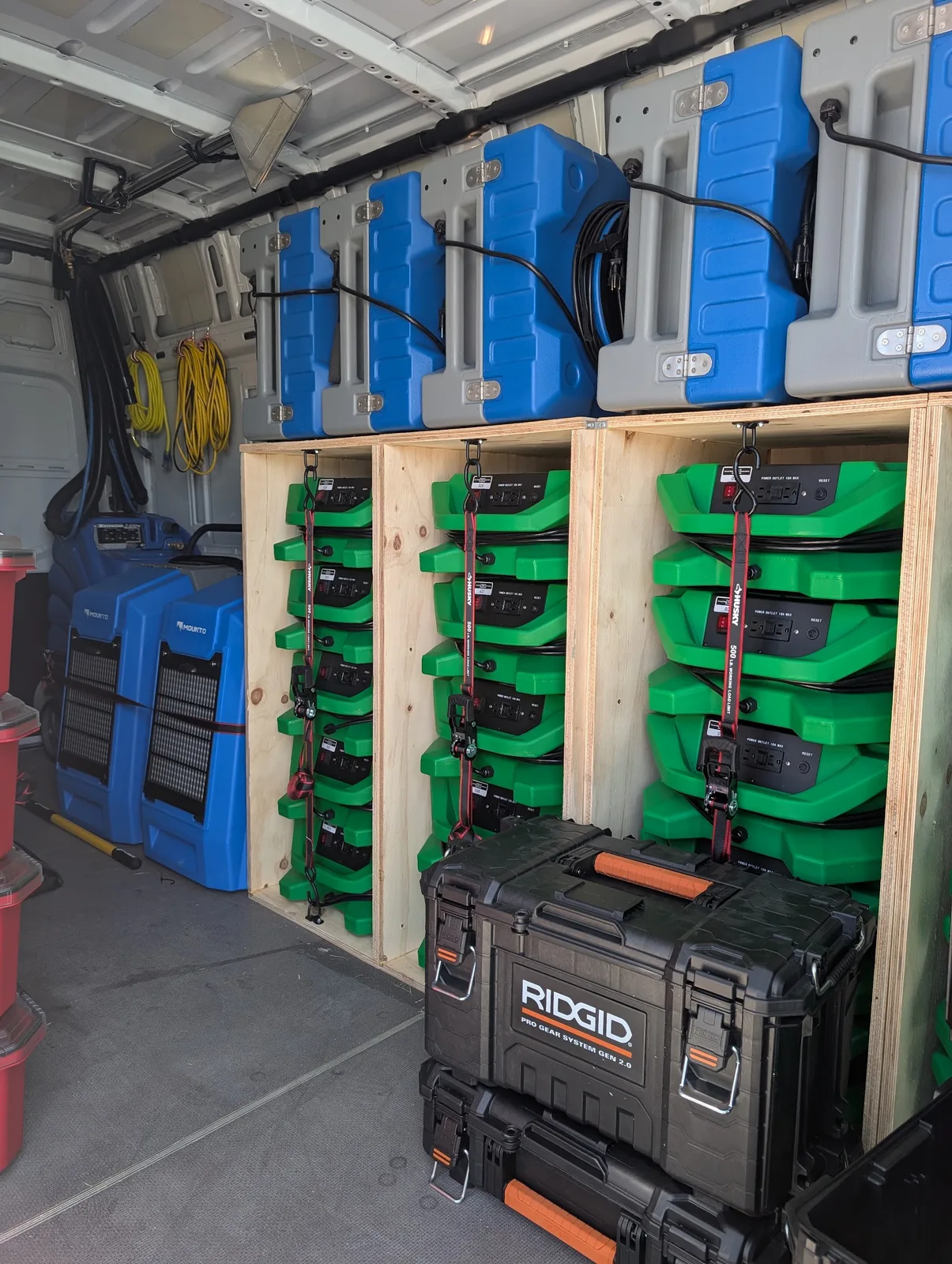 Warrior Restoration response van racked with air movers and dehumidifiers, ready for deployment
