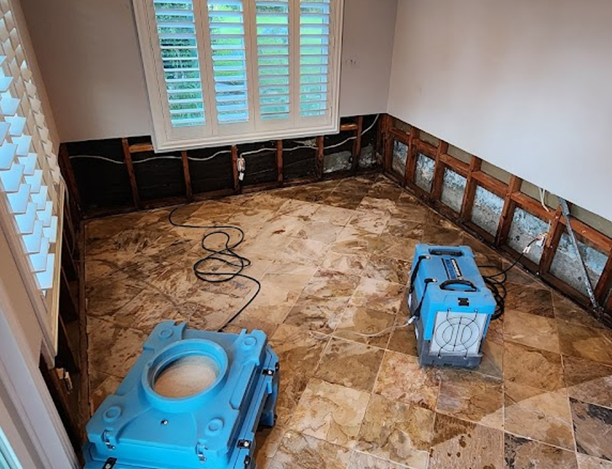 Warrior Restoration crew performing water mitigation and structural drying in a North Texas home